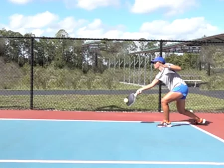 Pickleball player practicing the third shot drop technique